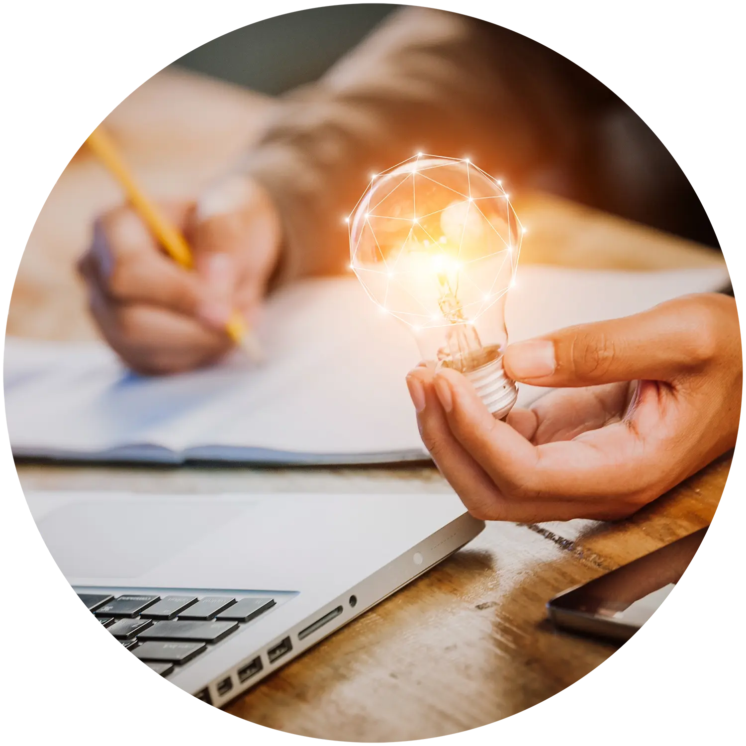 Man writing notes using data insights and holding a light bulb