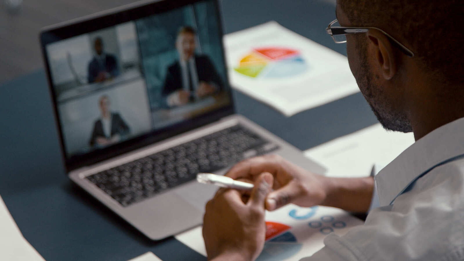 businessman-communicating-on-video-at-home