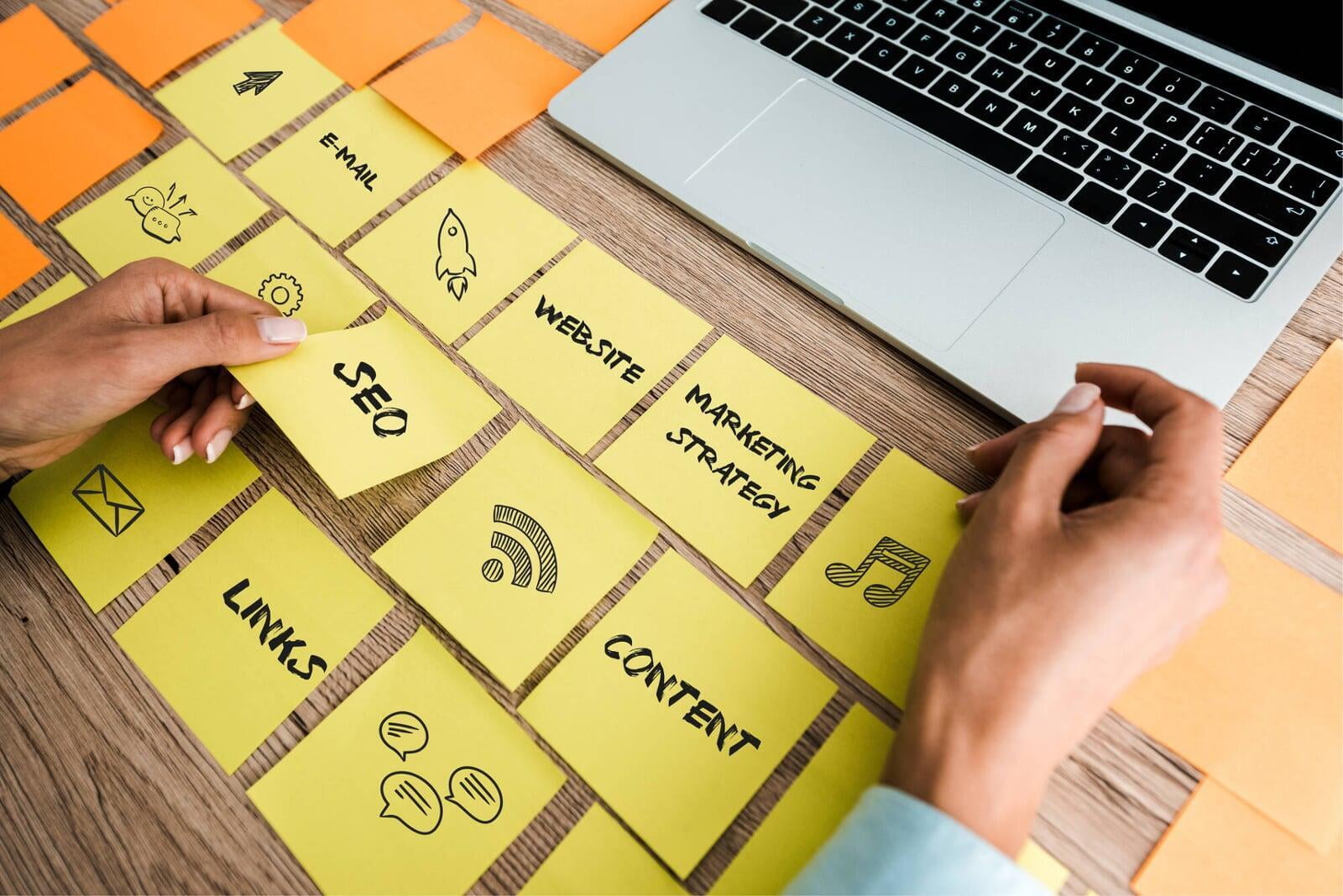 woman planning content strategy with sticky notes